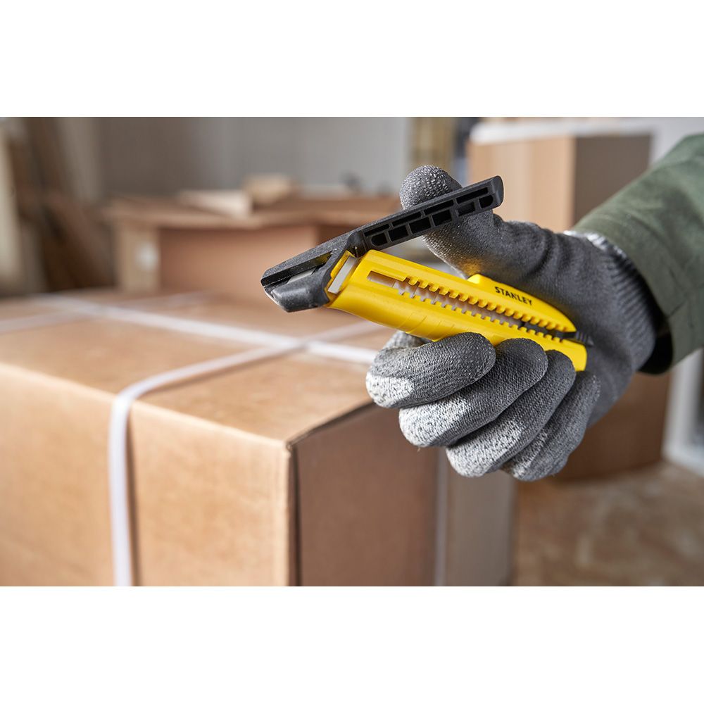 Cúter bi-material segmentación lateral con deslizador estándar 18 mm