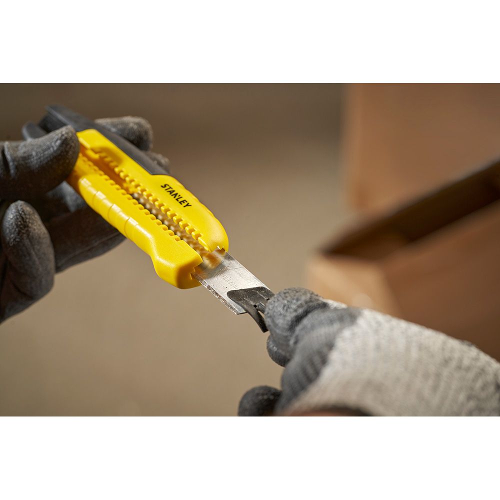 Cúter bi-material segmentación lateral con deslizador estándar 18 mm