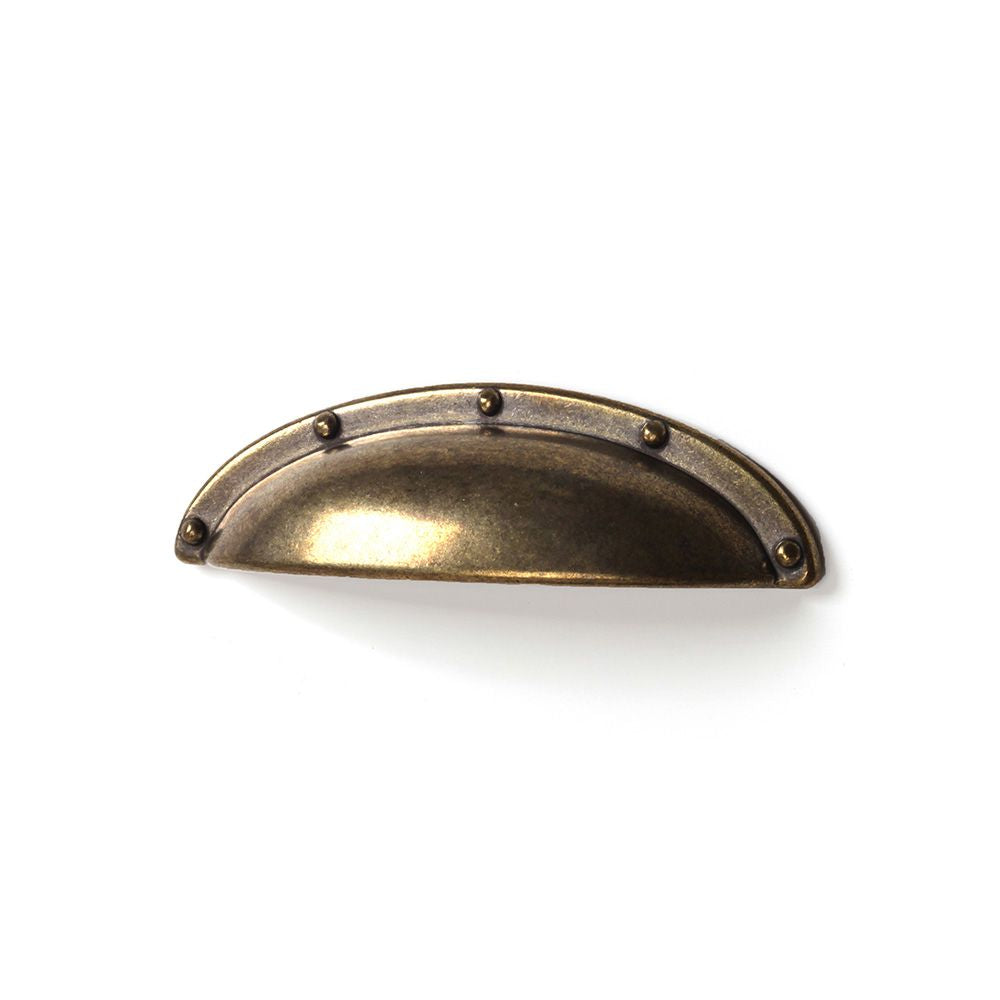 Tirador de mueble tipo concha mod. 2004 de zamak con acabado cuero viejo, 64 mm, blister 4 uds