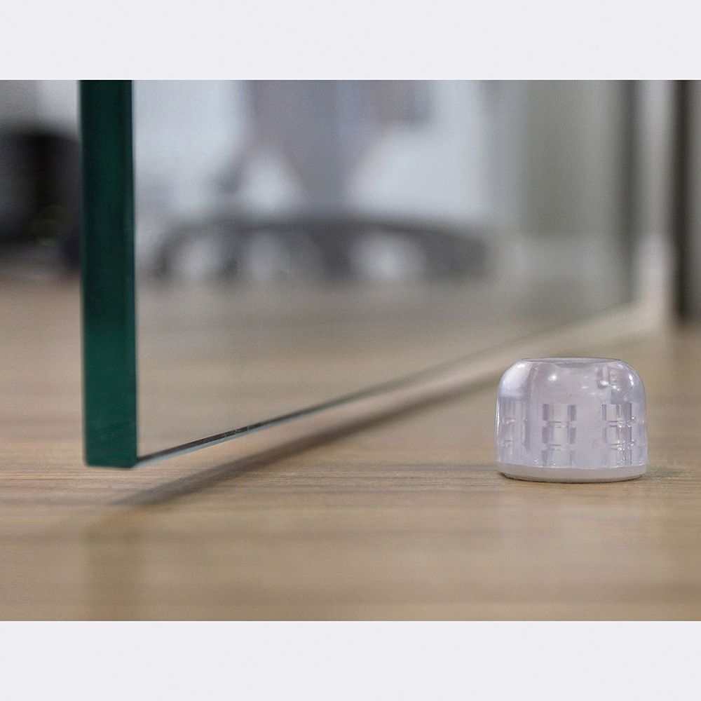 Tope de puerta, de plástico con acabado transparente, fijación con adhesivo